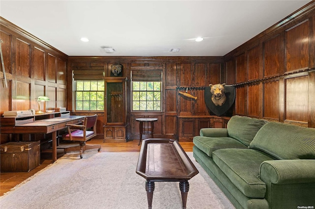 interior space featuring wood walls and light hardwood / wood-style flooring