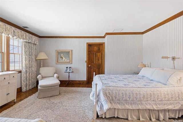 bedroom featuring crown molding and hardwood / wood-style floors