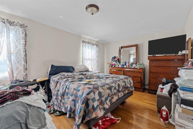 bedroom with light hardwood / wood-style floors