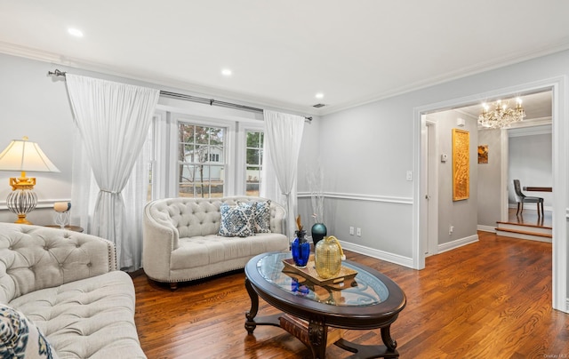 living room with an inviting chandelier, crown molding, and dark wood-type flooring