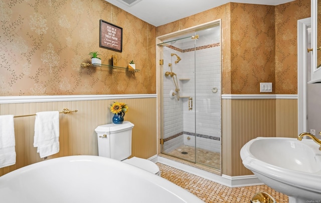 bathroom featuring sink, plus walk in shower, and tile patterned flooring