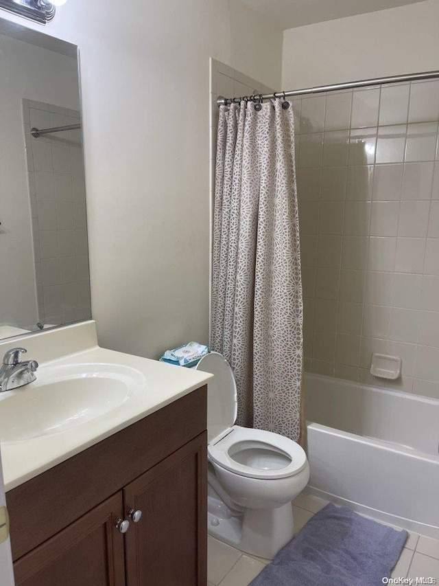 full bathroom featuring tile patterned flooring, vanity, toilet, and shower / bath combo with shower curtain