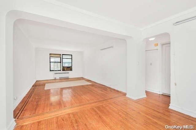 spare room with wood-type flooring