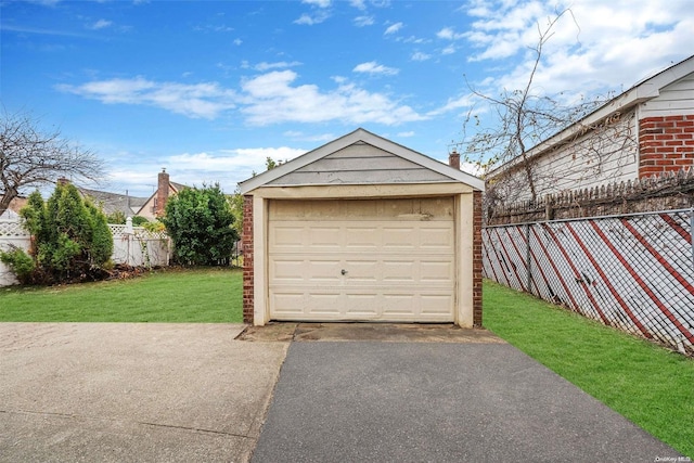 garage featuring a yard