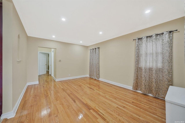 spare room featuring light wood-type flooring