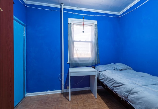 bedroom with dark parquet floors and ornamental molding