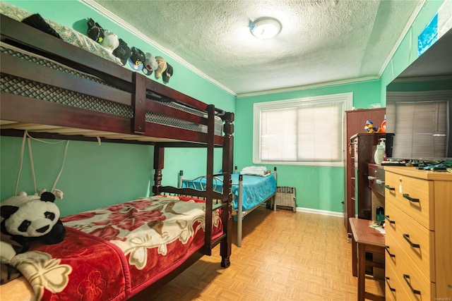 bedroom featuring radiator heating unit, a textured ceiling, light parquet floors, and crown molding