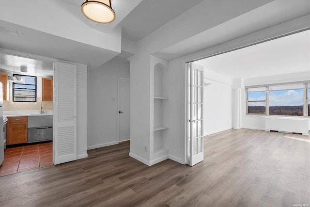 interior space featuring dark wood-type flooring and radiator