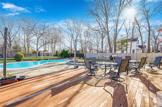 deck with a fenced in pool