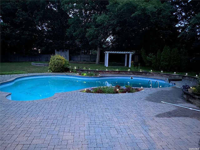 view of pool featuring a pergola, a yard, and a patio