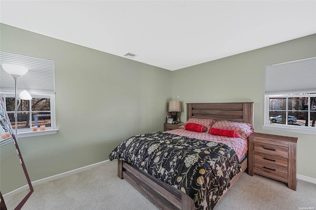 bedroom with light colored carpet