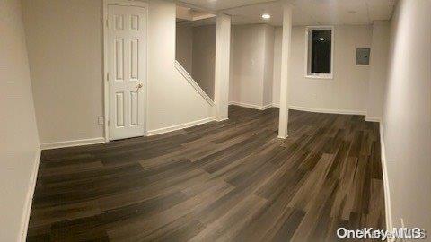 basement with dark wood-type flooring