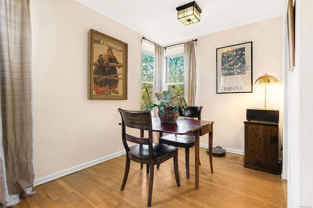 dining area with light hardwood / wood-style flooring