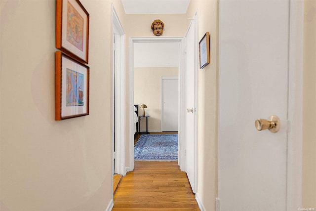 corridor featuring light hardwood / wood-style flooring