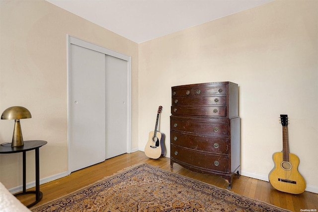 bedroom with a closet and wood-type flooring