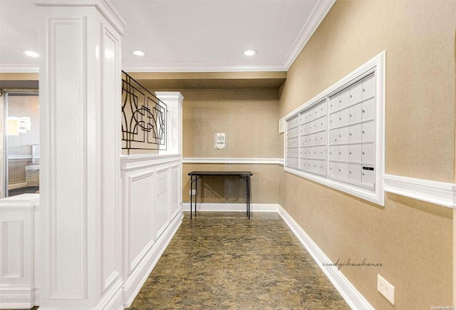 hallway with a mail area and crown molding