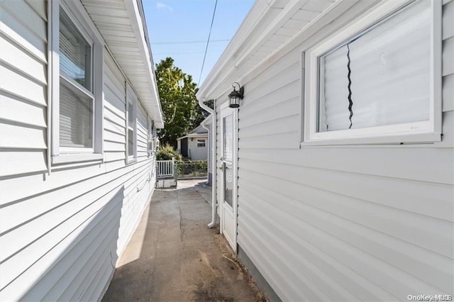 view of side of property with a patio area