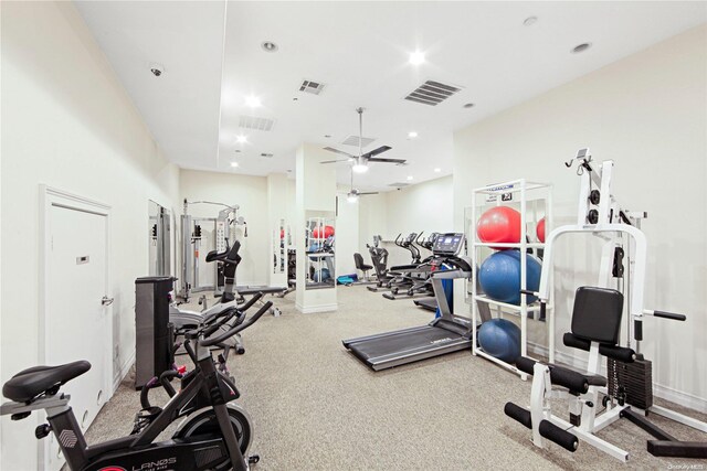 exercise room with carpet and ceiling fan