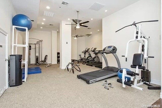 gym featuring ceiling fan and carpet floors