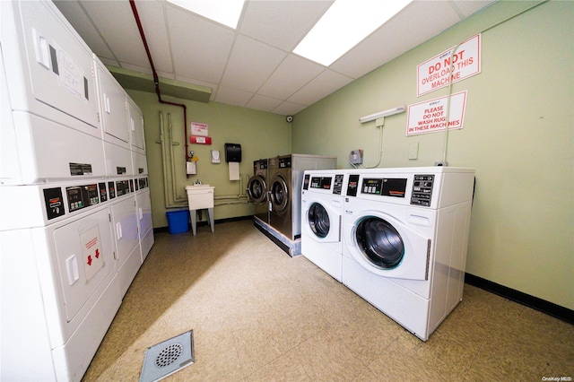 washroom with sink, independent washer and dryer, and stacked washer / dryer