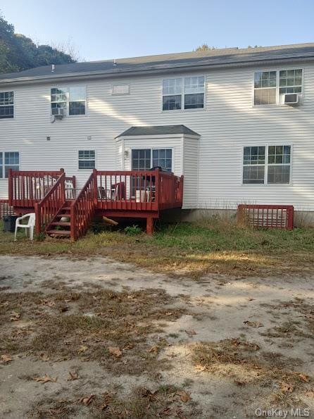 back of property featuring a deck