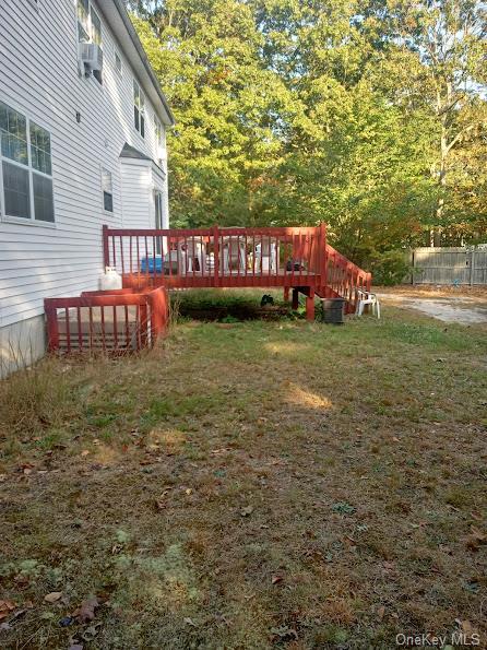 view of yard featuring a wooden deck