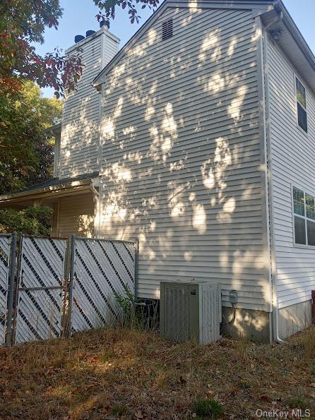 view of property exterior featuring central air condition unit