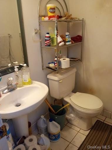 bathroom featuring tile patterned flooring and toilet