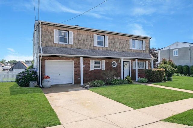 view of front of house with a garage and a front yard