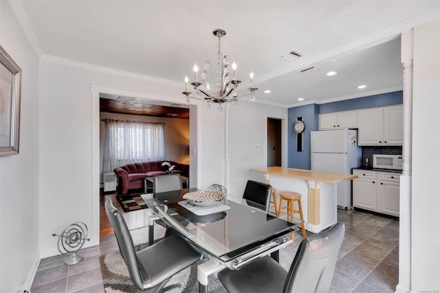 dining space featuring an inviting chandelier and ornamental molding