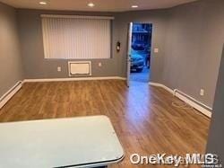 unfurnished room featuring wood-type flooring