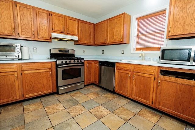 kitchen with appliances with stainless steel finishes and sink