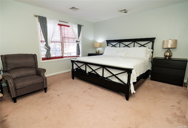 bedroom with light colored carpet