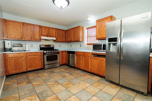 kitchen with appliances with stainless steel finishes and sink