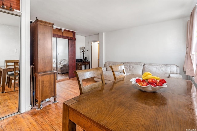 dining area featuring light wood-type flooring