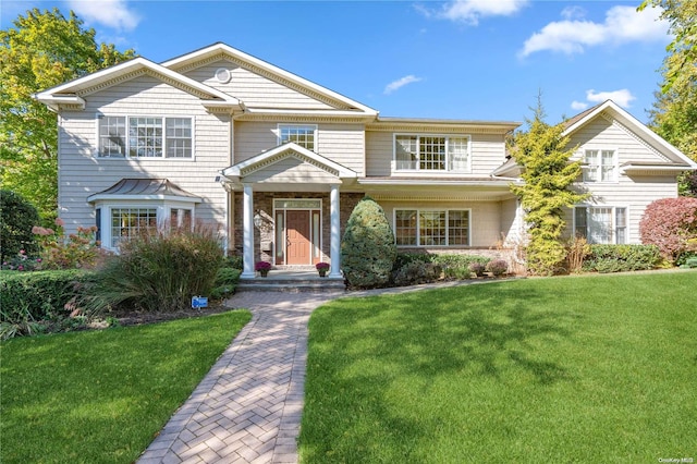 view of front of property with a front lawn