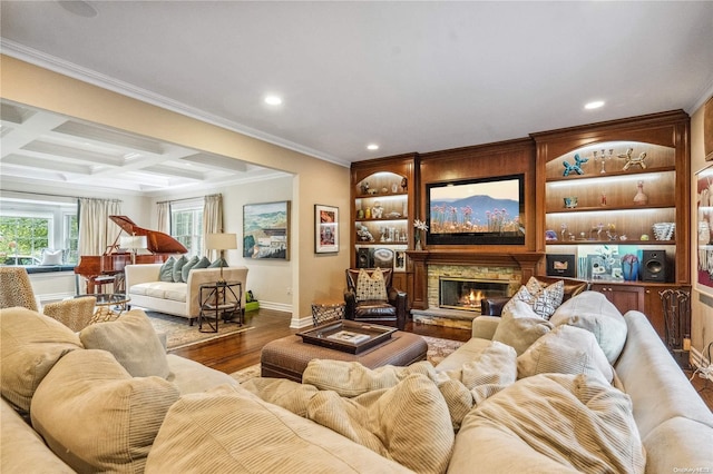 living room featuring coffered ceiling, crown molding, beam ceiling, a fireplace, and hardwood / wood-style floors