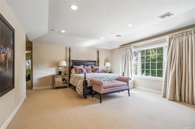 carpeted bedroom with lofted ceiling