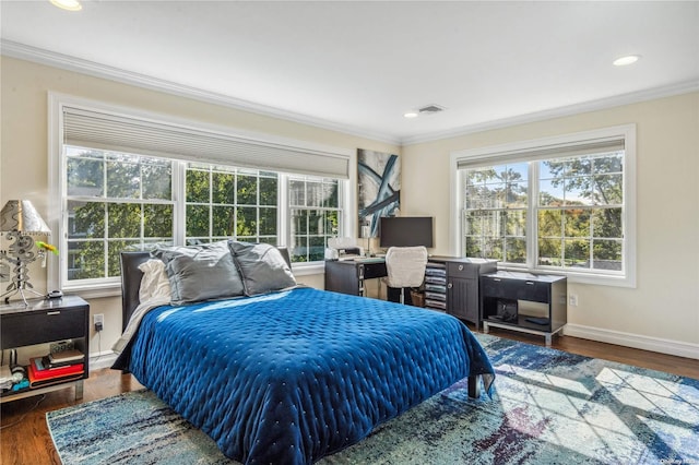 bedroom featuring dark hardwood / wood-style flooring and crown molding