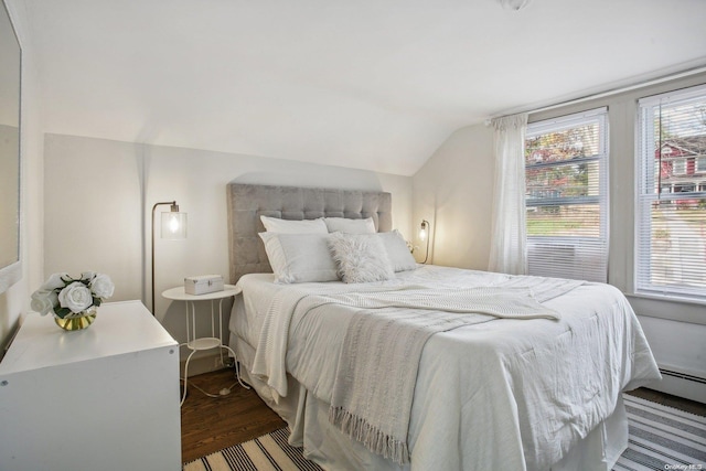 bedroom with dark hardwood / wood-style flooring and vaulted ceiling