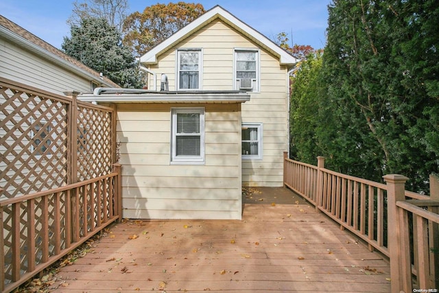 exterior space featuring cooling unit and a wooden deck