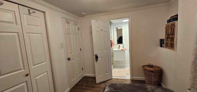 hall featuring dark hardwood / wood-style floors and ornamental molding