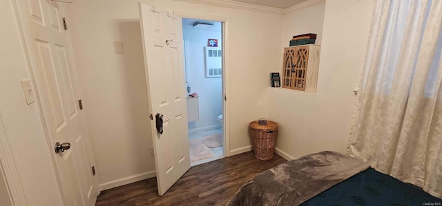 interior space with crown molding and dark wood-type flooring