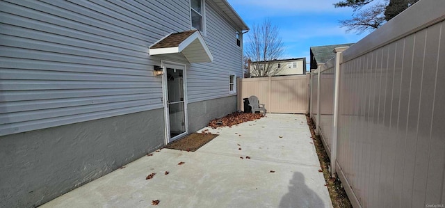 view of side of home featuring a patio