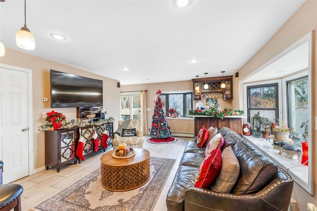 living room featuring a baseboard heating unit and bar