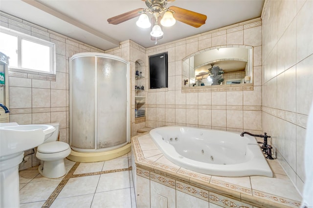 bathroom with toilet, tile patterned flooring, tile walls, ceiling fan, and independent shower and bath