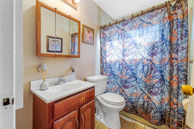 bathroom with toilet, tile patterned flooring, walk in shower, and vanity