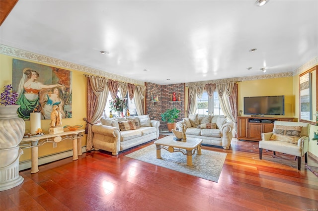 living room with a baseboard radiator and hardwood / wood-style floors