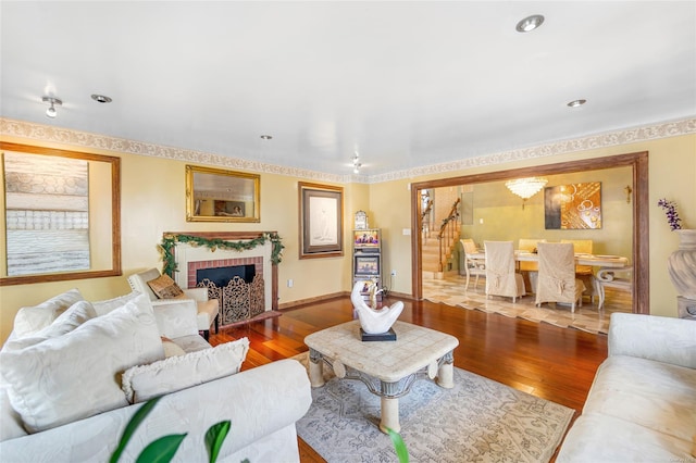 living room featuring a fireplace and wood-type flooring