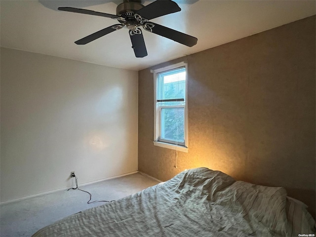 bedroom with light colored carpet and ceiling fan